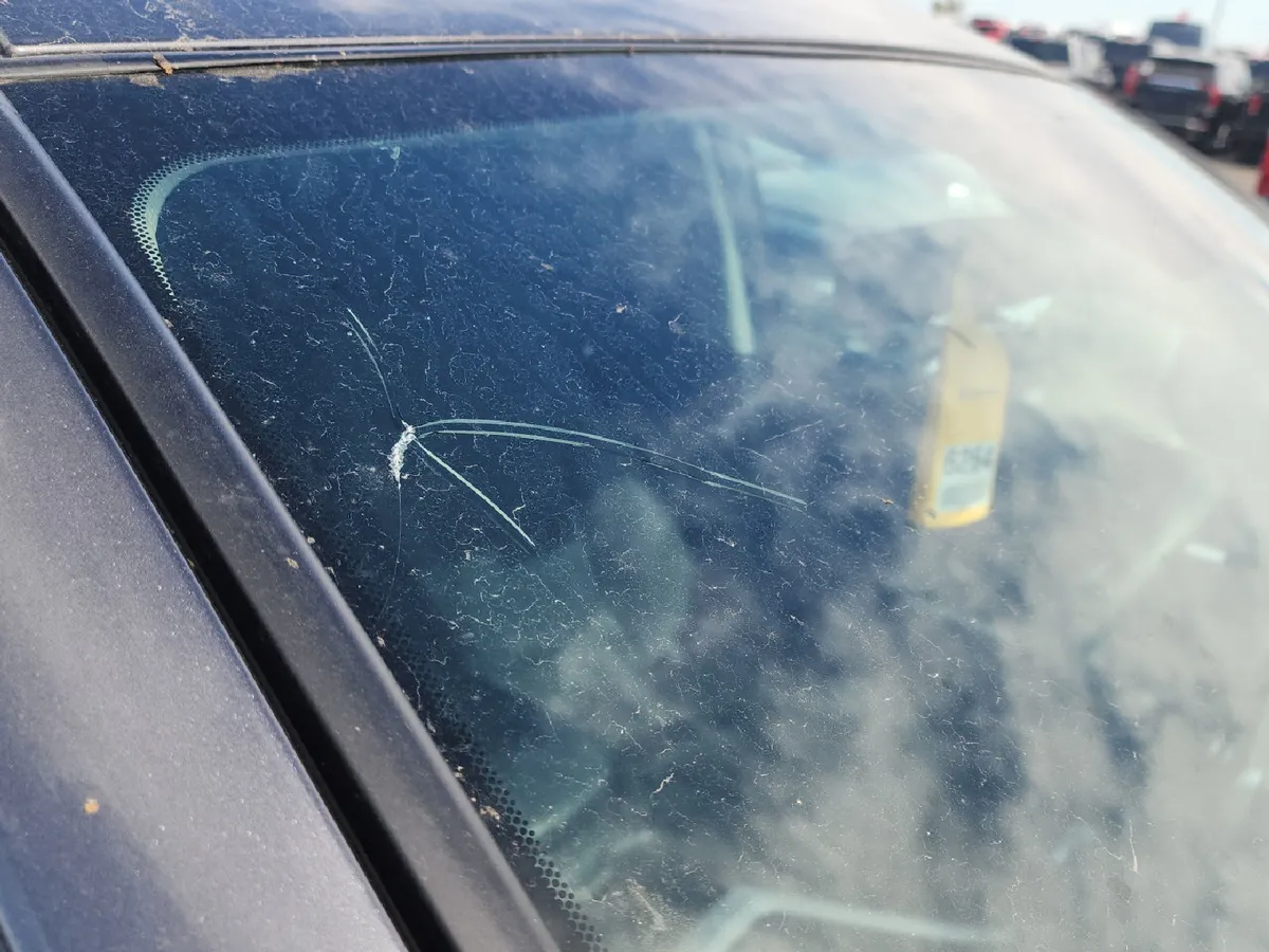 Close-up of a crack in the 2025 Toyota RAV4's windshield, near the top of the glass