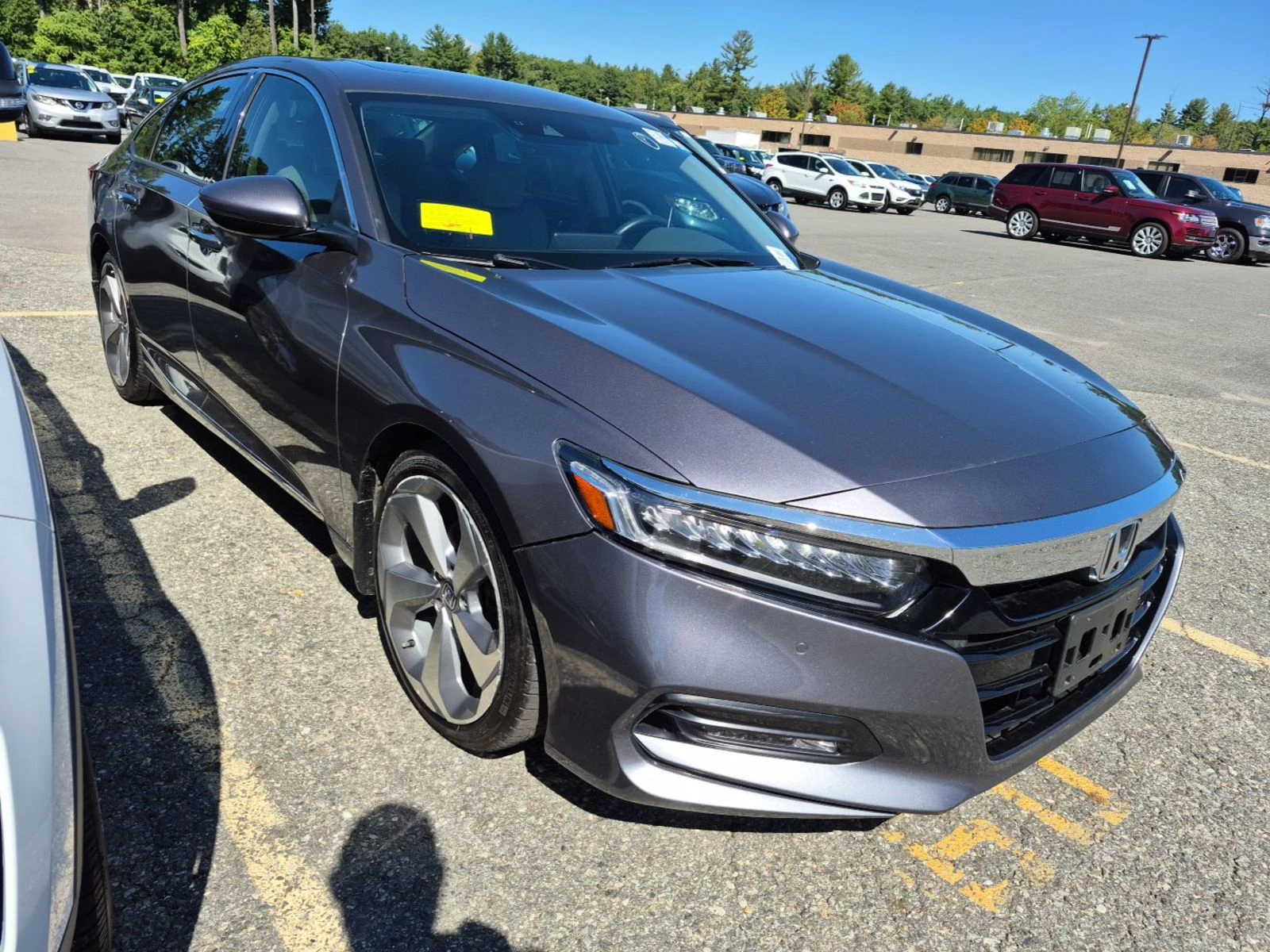 2018 Honda Accord Touring in gray, front three-quarter view on the auction lot, sharp modern body with LED headlights and alloy wheels