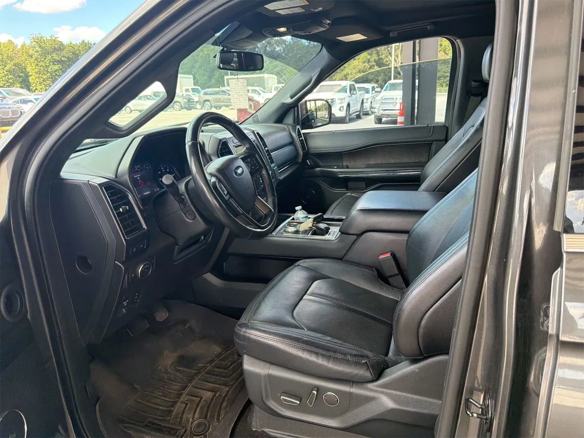 Interior of the 2020 Ford Expedition Limited showing black leather front seats and dash