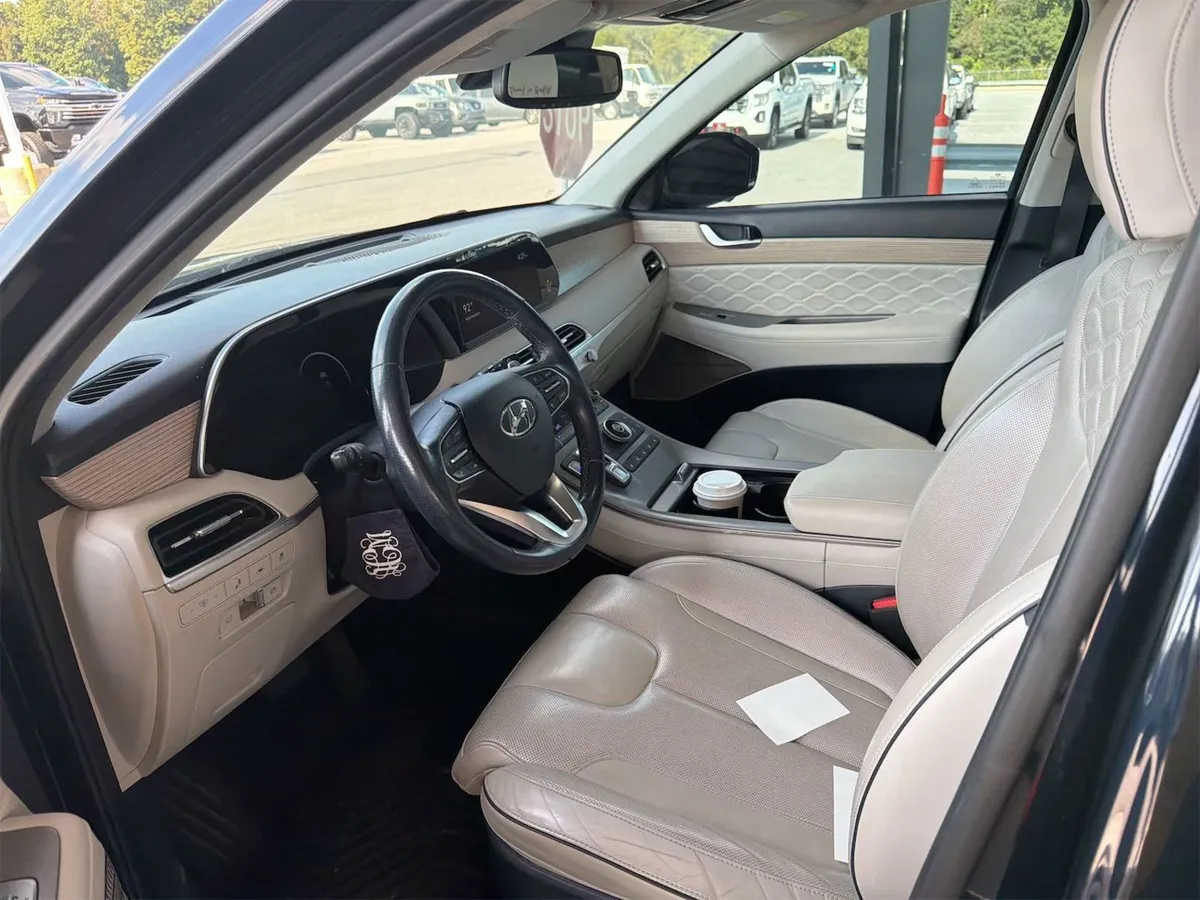 Interior of the 2021 Hyundai Palisade Calligraphy with light quilted leather seats and a wood-trim dash